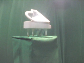45 Degrees _ Picture 9 _ White Grand Piano 1.png